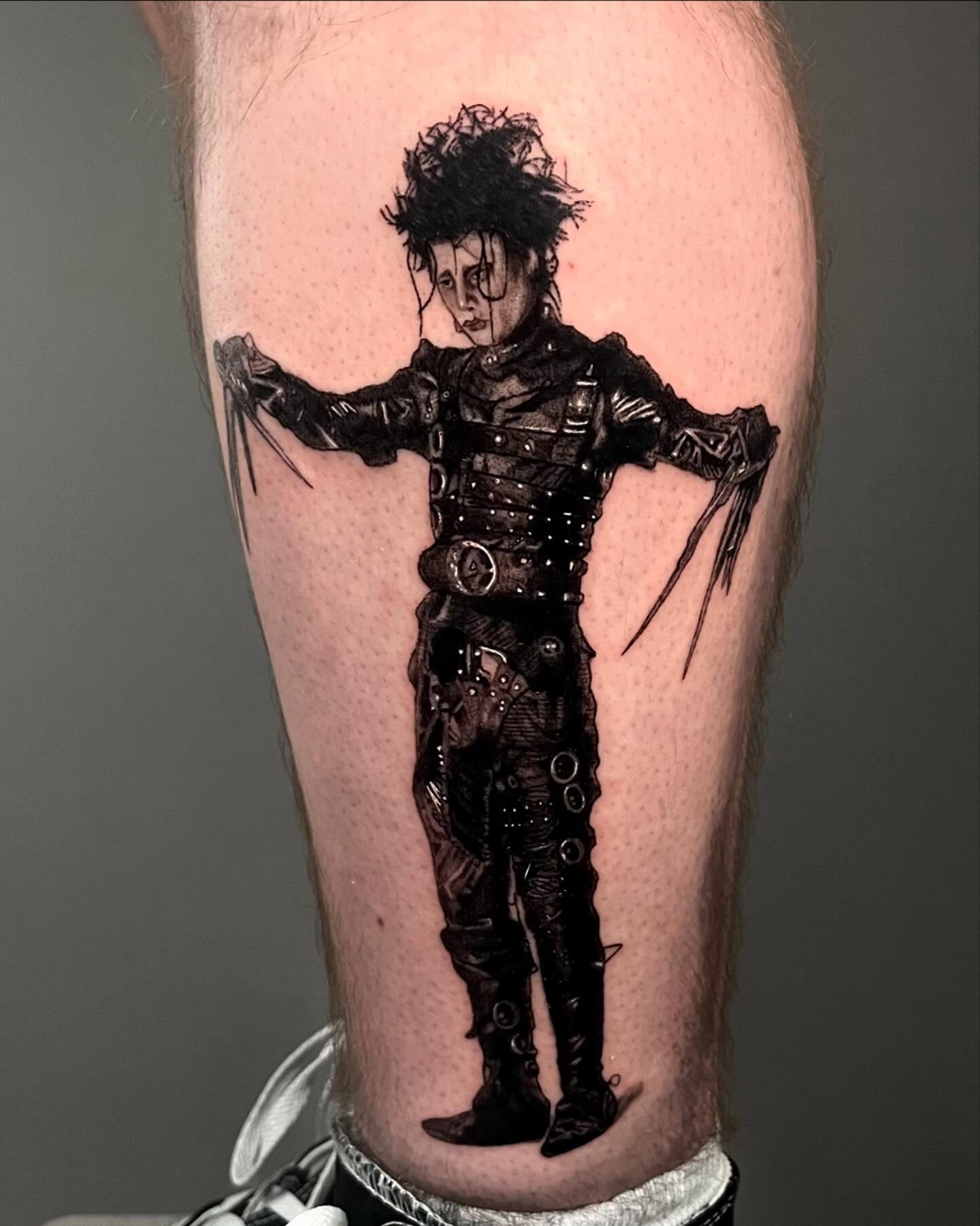 Tattoo by @jiinkytattoos — black_and_grey, realism