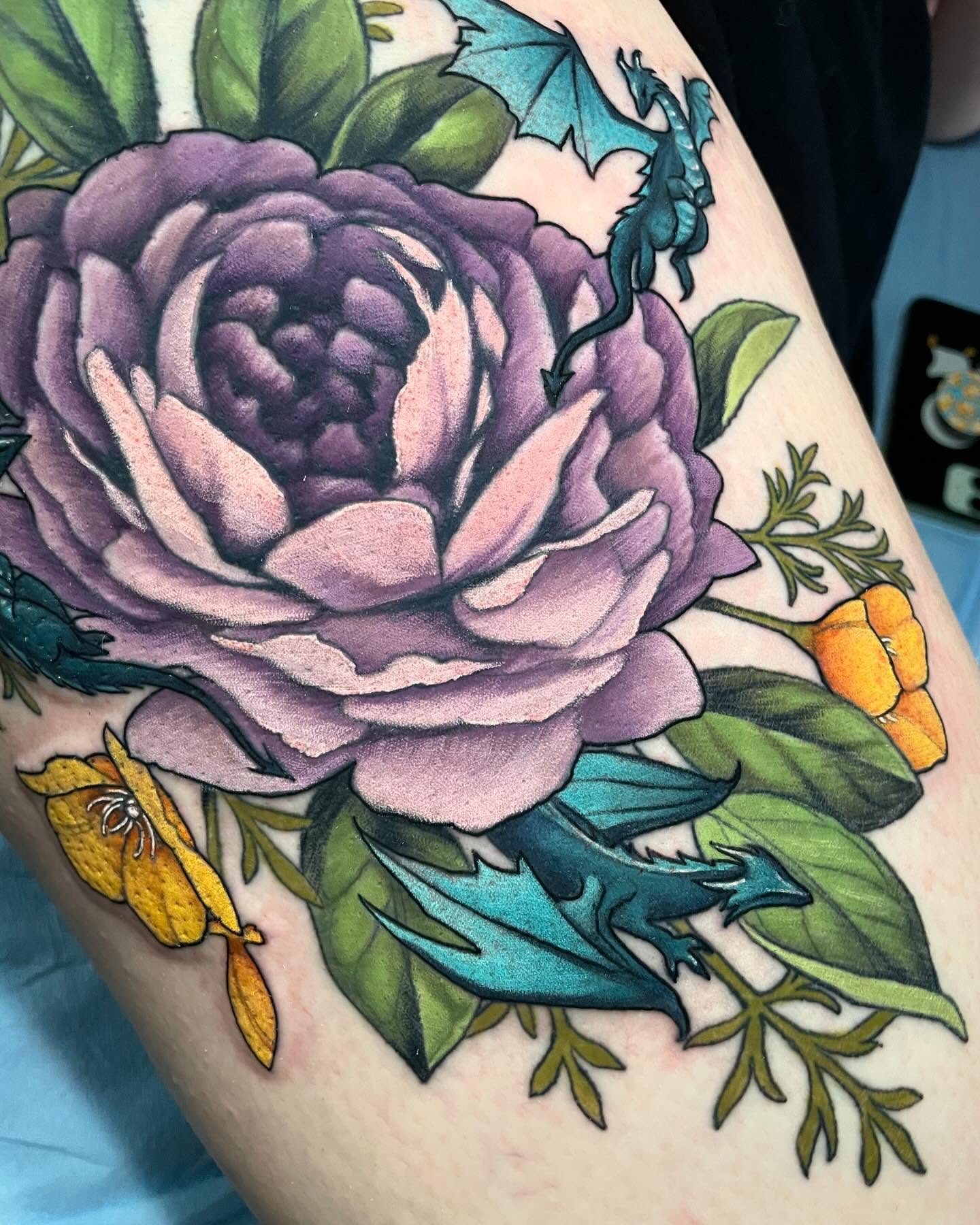 Purple rose realism tattoo on the thigh by Leah Marie, Cincinnati