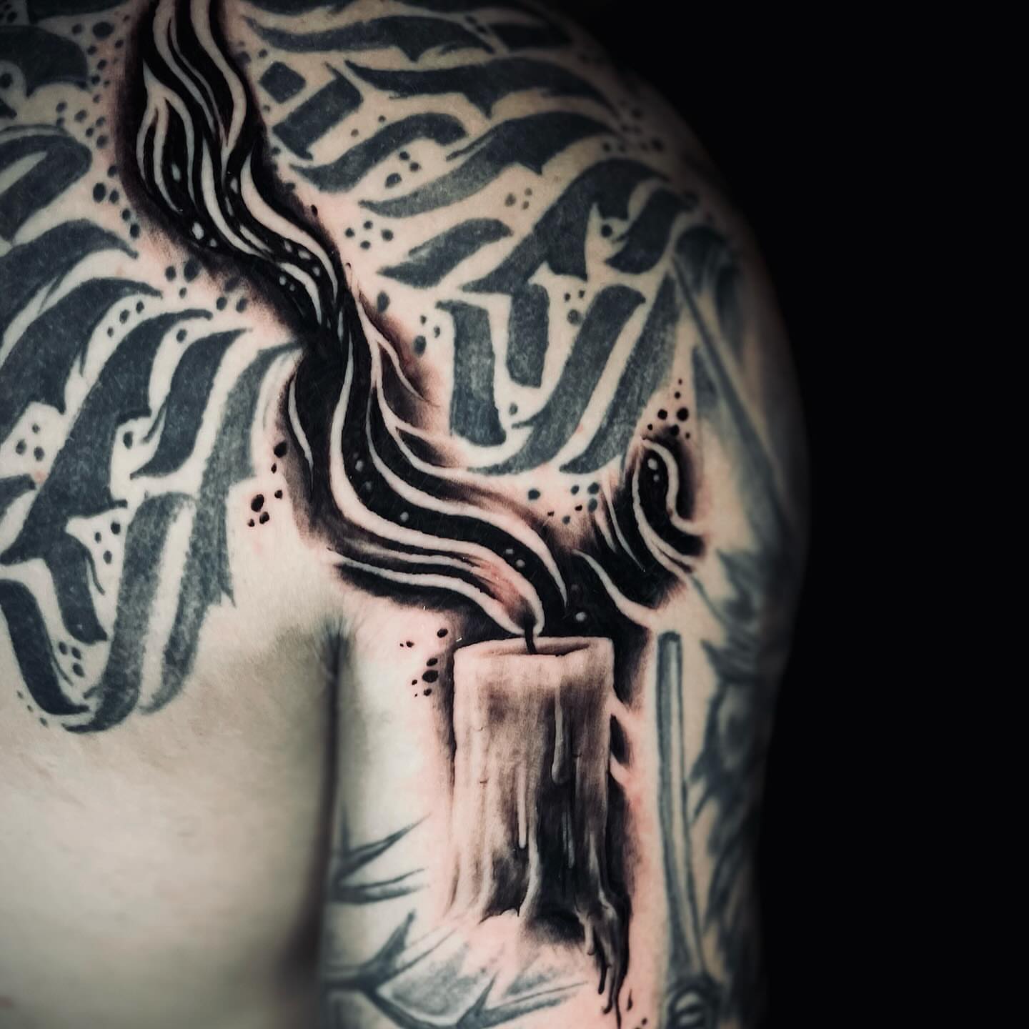 Burning candle realism tattoo on the shoulder by Bryce Presley, Mission, Kansas