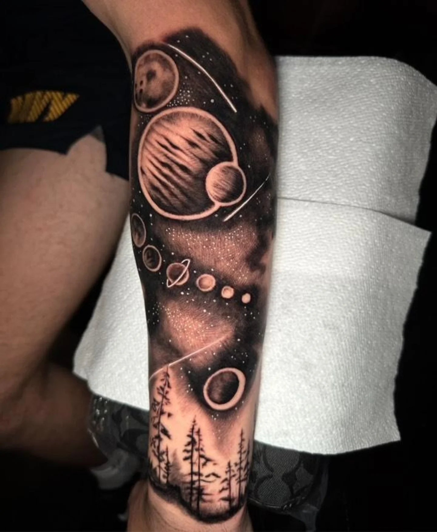 Space-themed tattoo realism tattoo on the forearm by Christopher Heffley