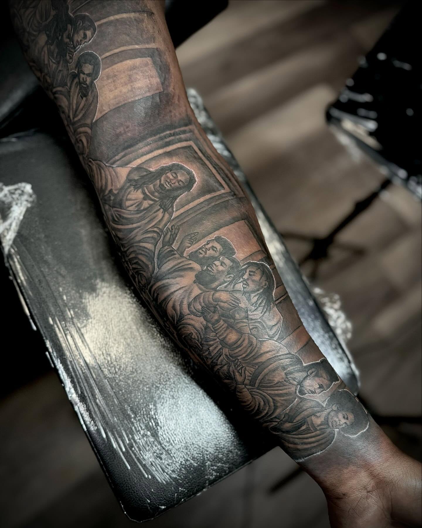 Religious scene realism tattoo on the forearm by Tatt2T (T King)