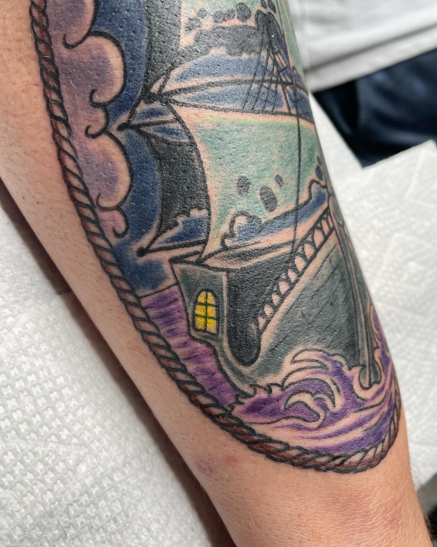 Ship sailing through storm American traditional tattoo on the forearm by Michelle