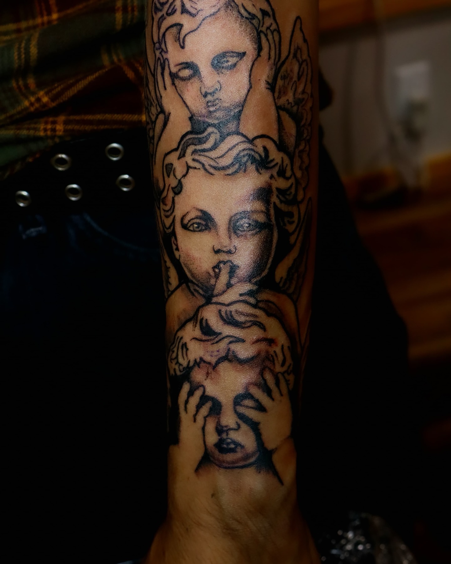 Angels black and grey tattoo on the forearm by Dallas Tattoo Artist