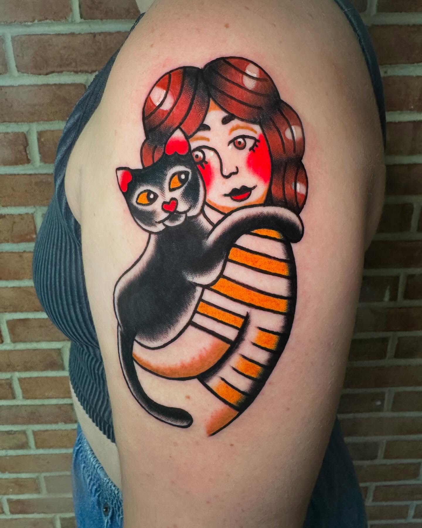 Woman and cat American traditional tattoo on the shoulder by Perrey