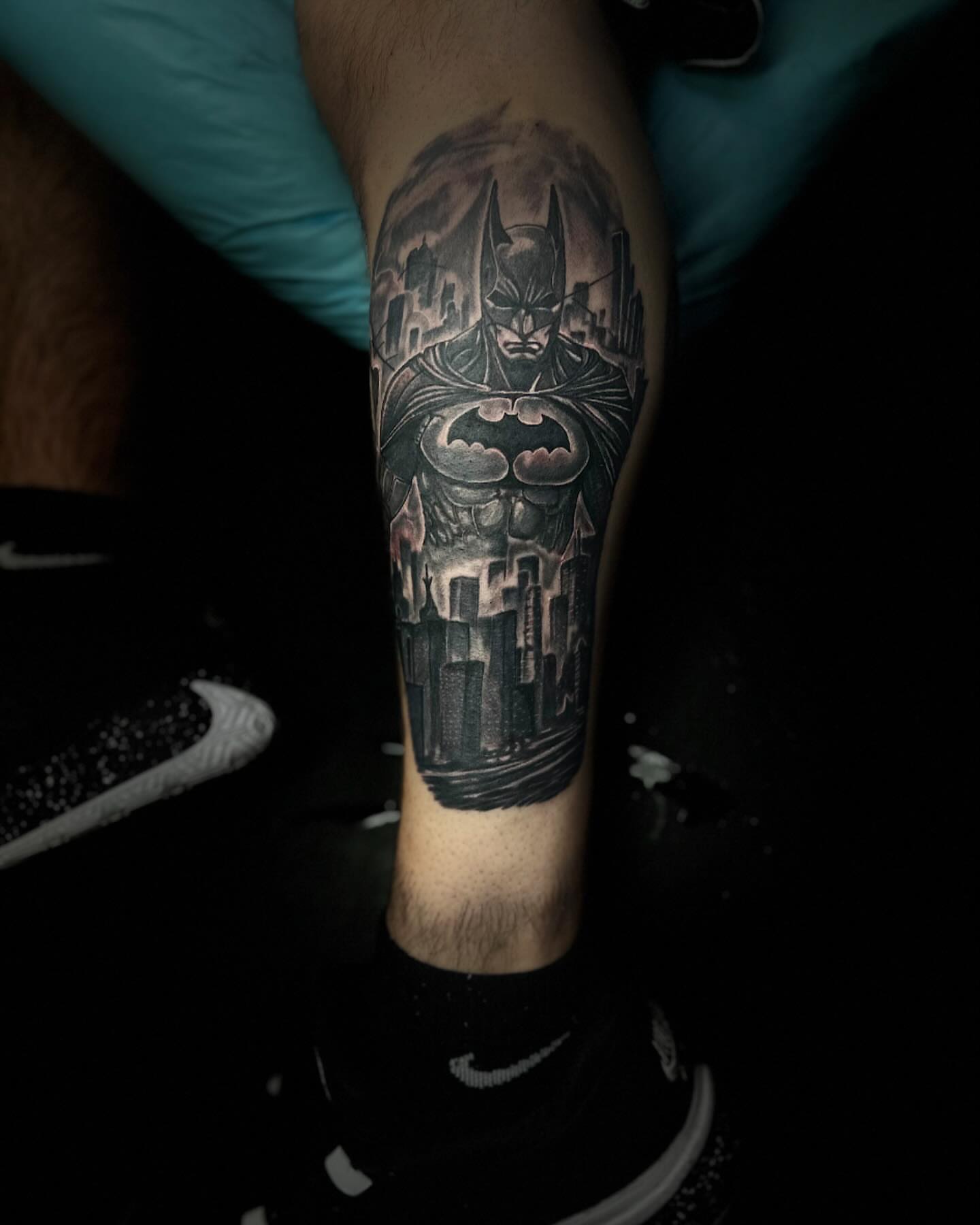 Batman black and grey tattoo on the forearm by Aj Negrete Jr.