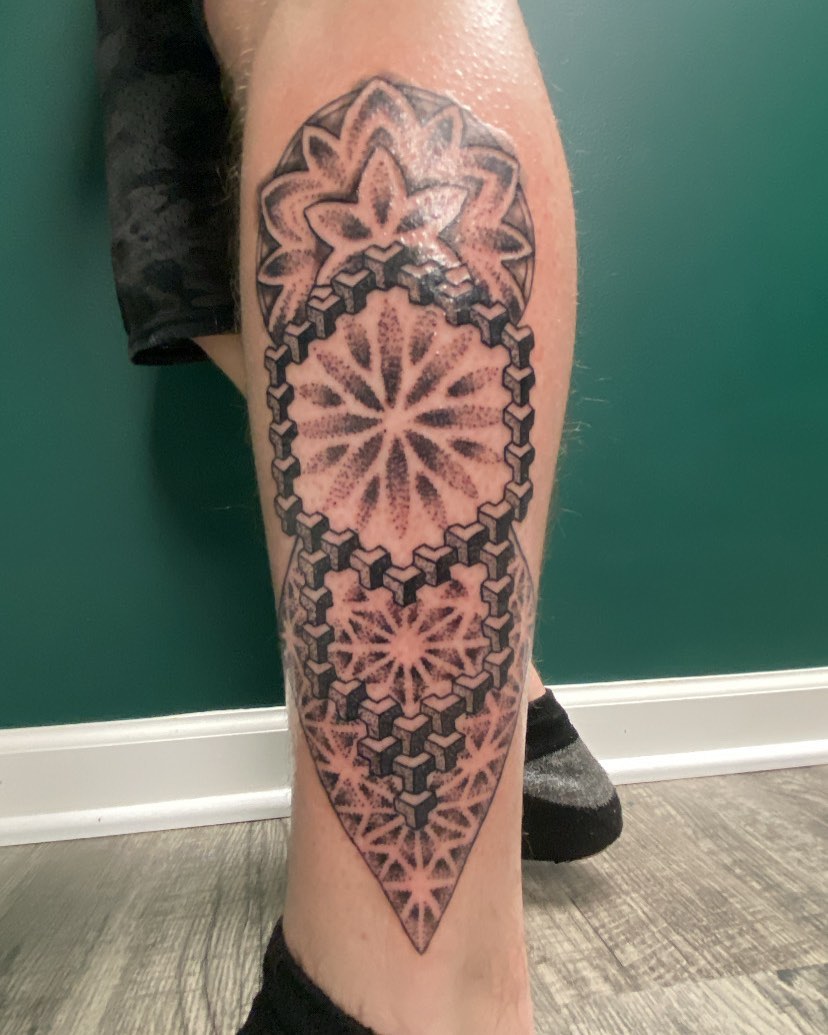 Geometric pattern geometric tattoo on the calf by Adrián Banuelos