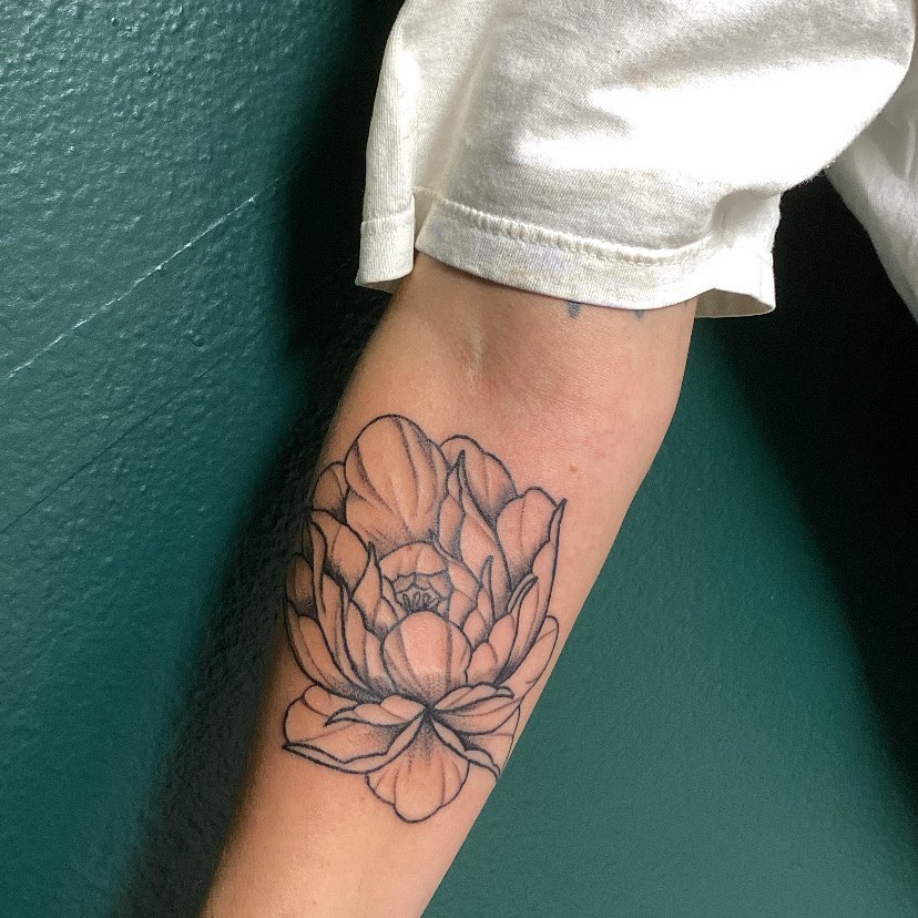 Lotus flower dotwork tattoo on the forearm by Adrián Banuelos