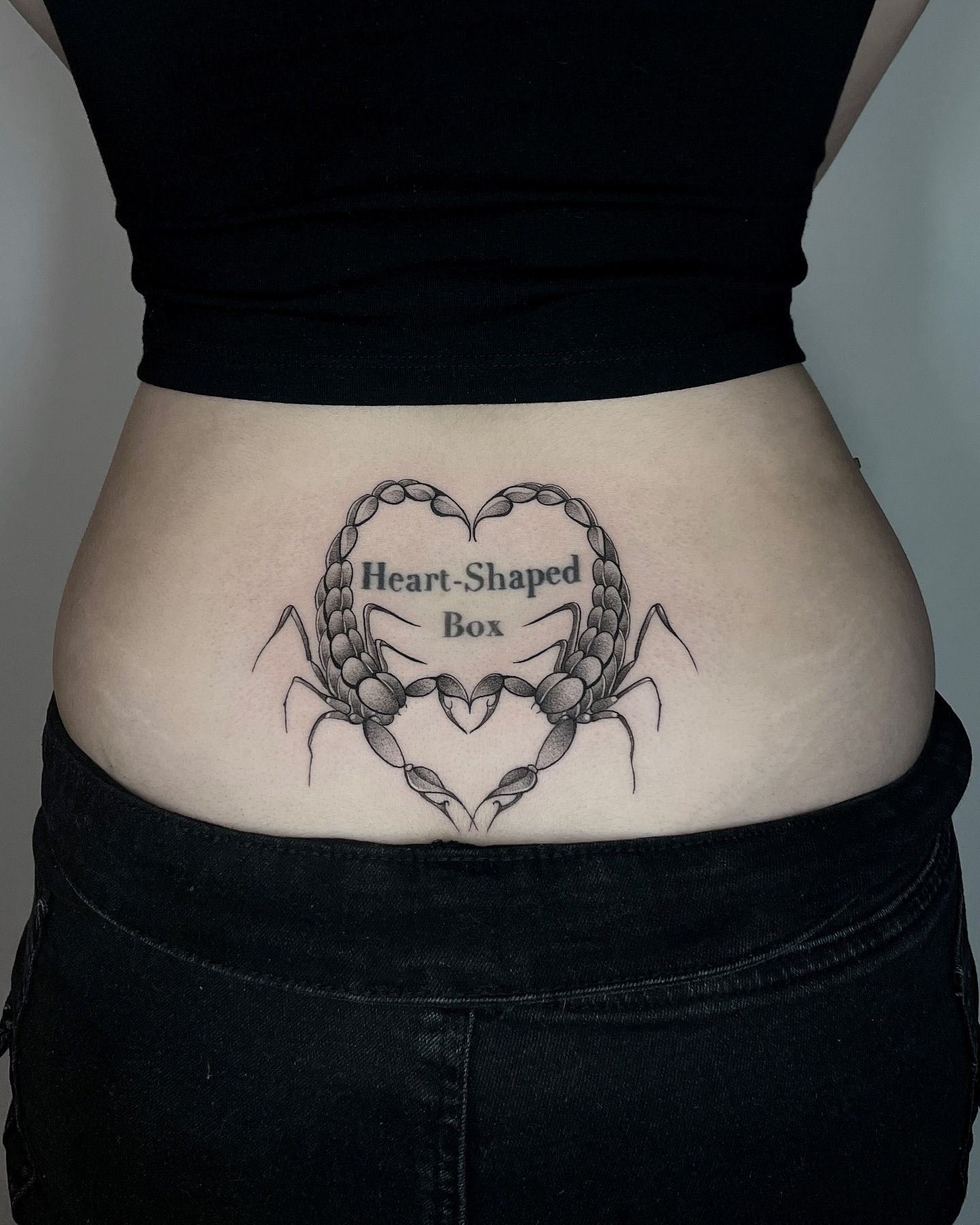 Heart-shaped box black and grey tattoo on the torso by Cybersigilism & Fineline Blackwork