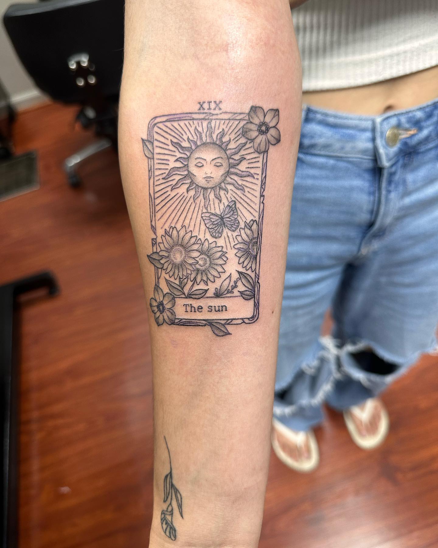 The sun tarot card black and grey tattoo on the forearm by Kat π
