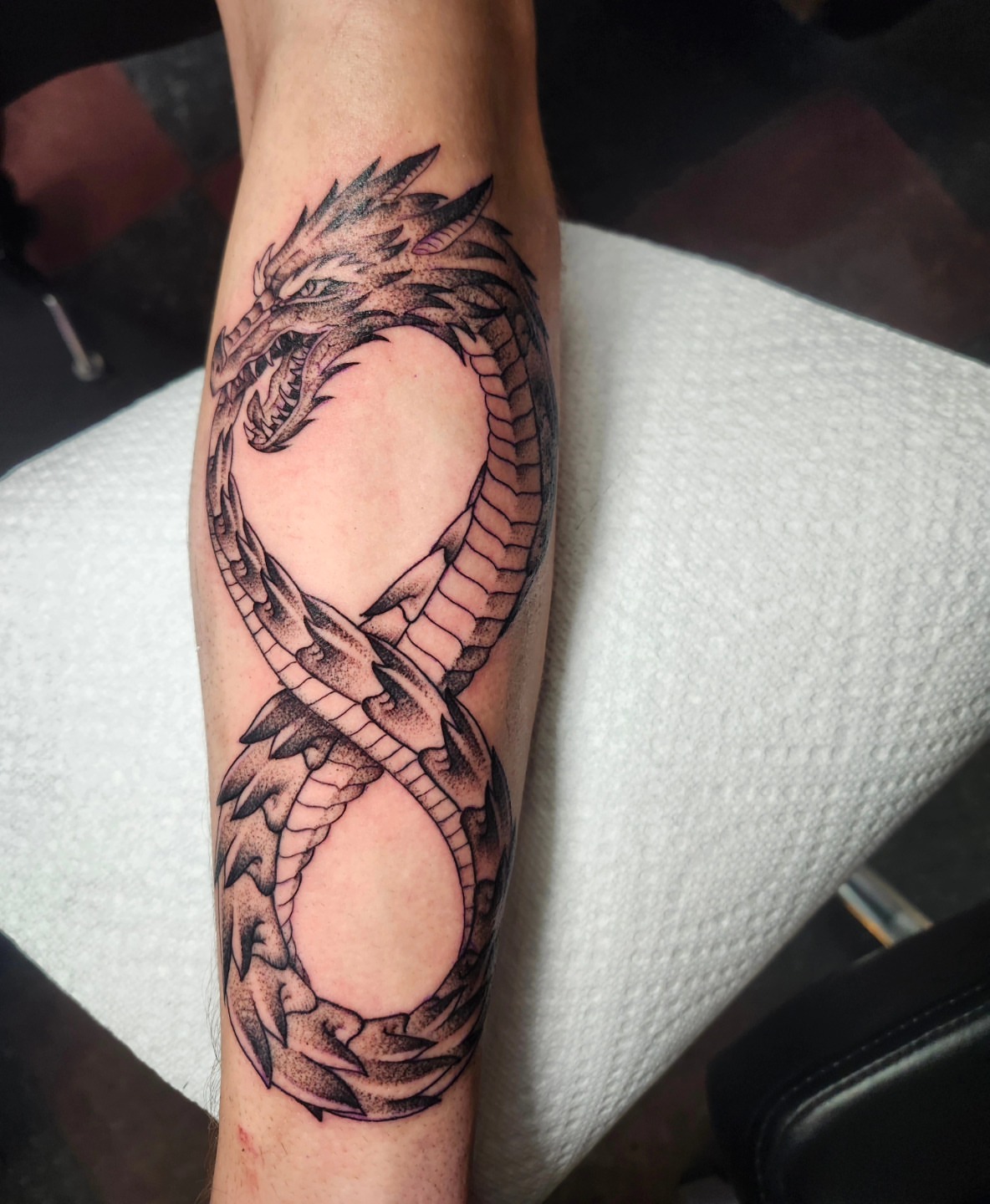 Dragon dotwork tattoo on the forearm by CASEY JENSEN ✨ Fort Collins CO