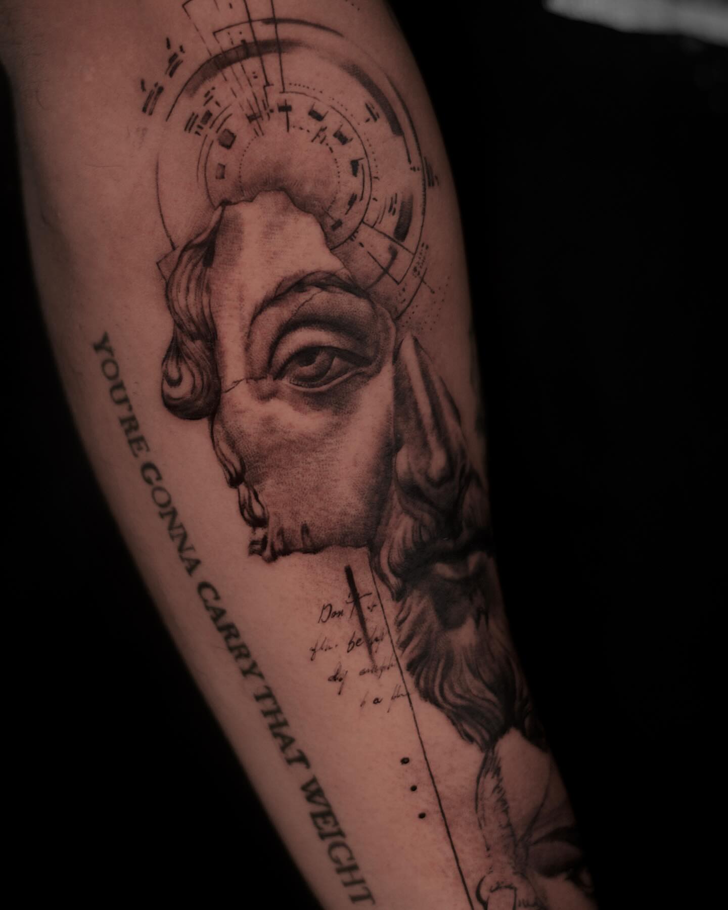 Religious figure realism tattoo on the forearm by Ron Alvarez