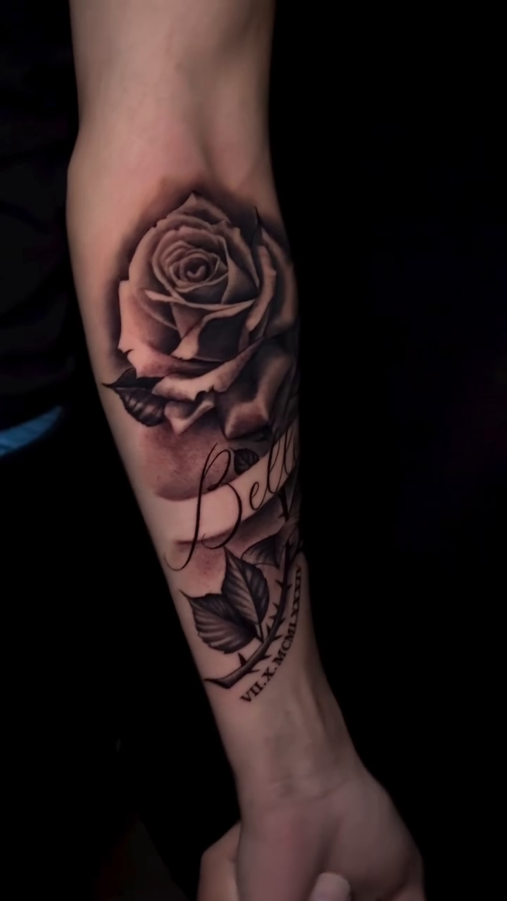 Rose with banner and beads realism tattoo by Ian Vanderwerff