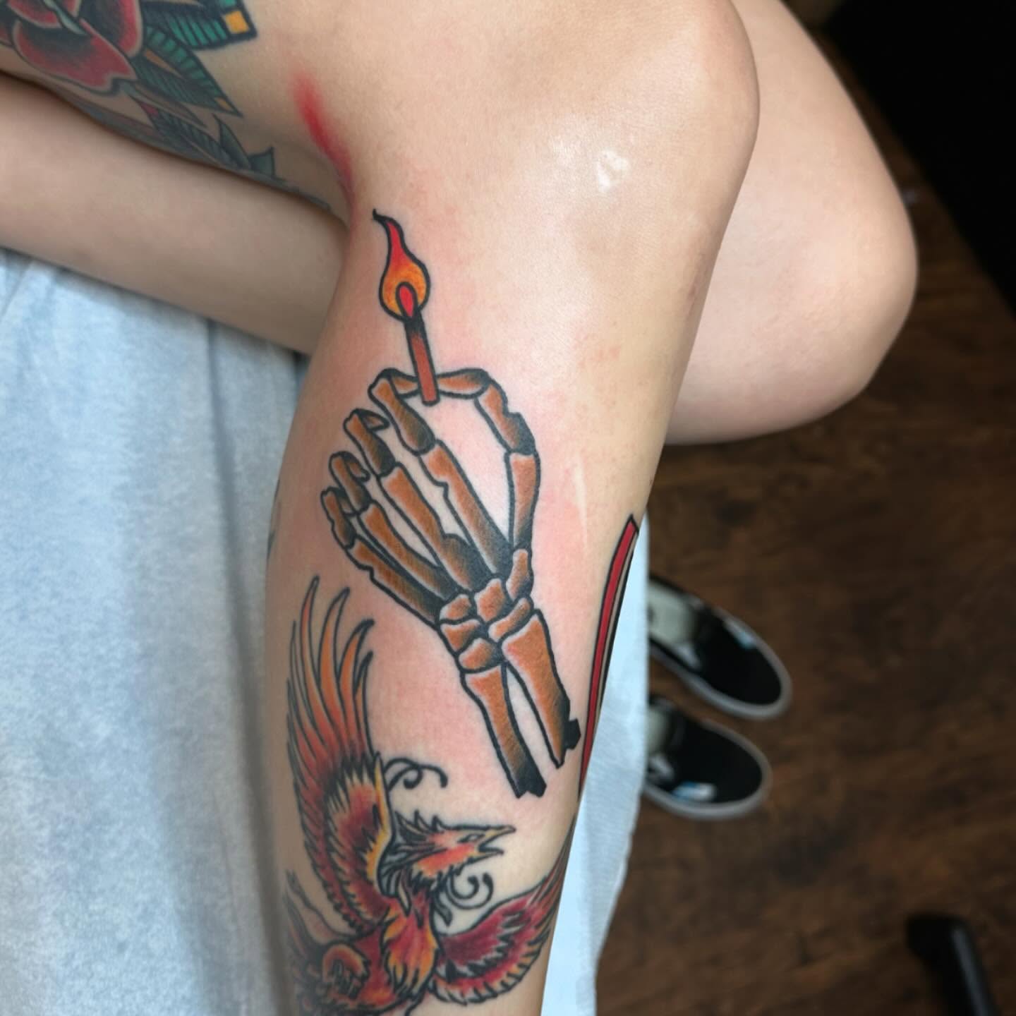 Skeleton hand holding candle American traditional tattoo on the forearm by Jackie