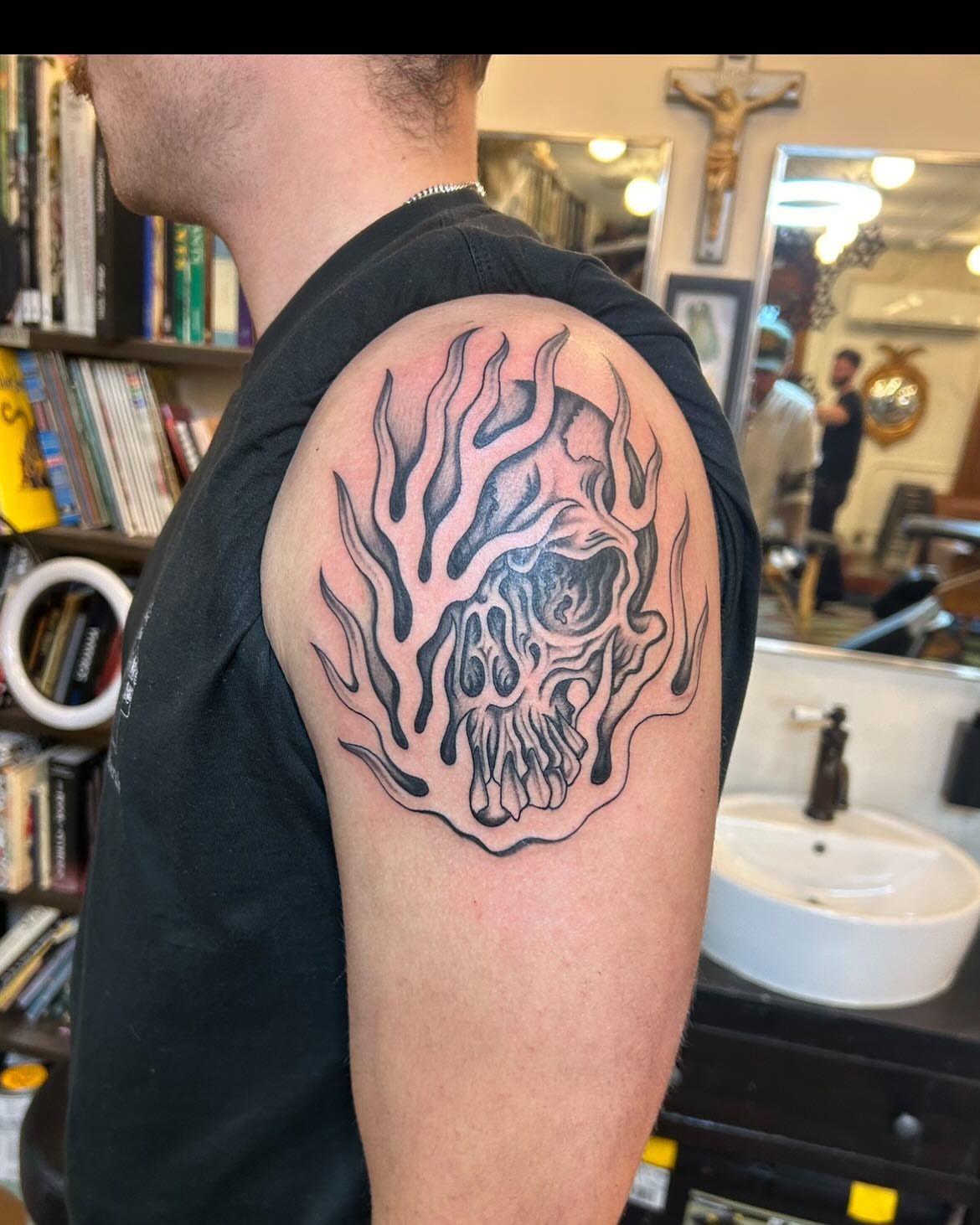 Flaming skull black and grey tattoo on the shoulder by Sam Perry, Denver, Colorado