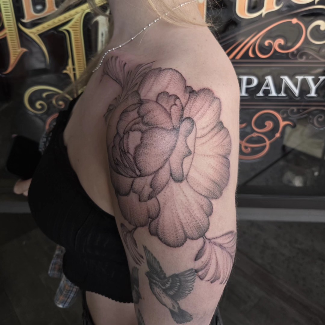 Peony and bird dotwork tattoo on the upper arm by Gabrielle Esperanza ☽。⋆