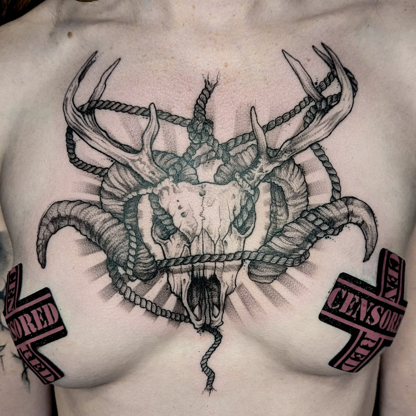 Skull with antlers realism tattoo on the chest by Gail Howard Perry III