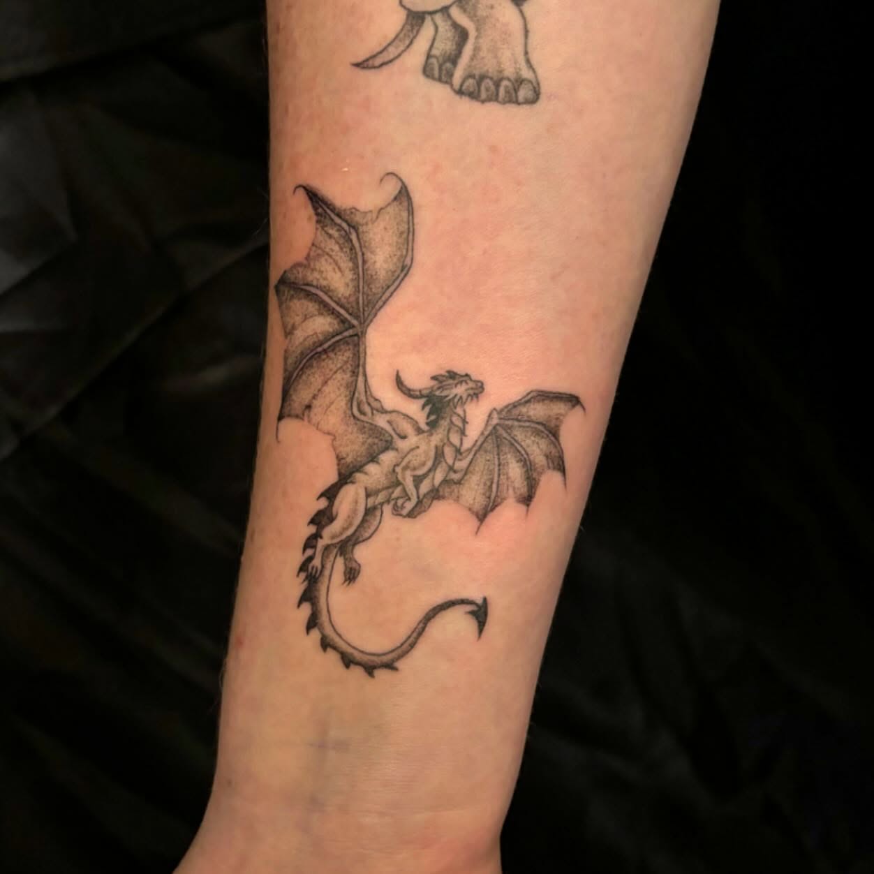 Dragon dotwork tattoo on the forearm by Kimberly Shordon