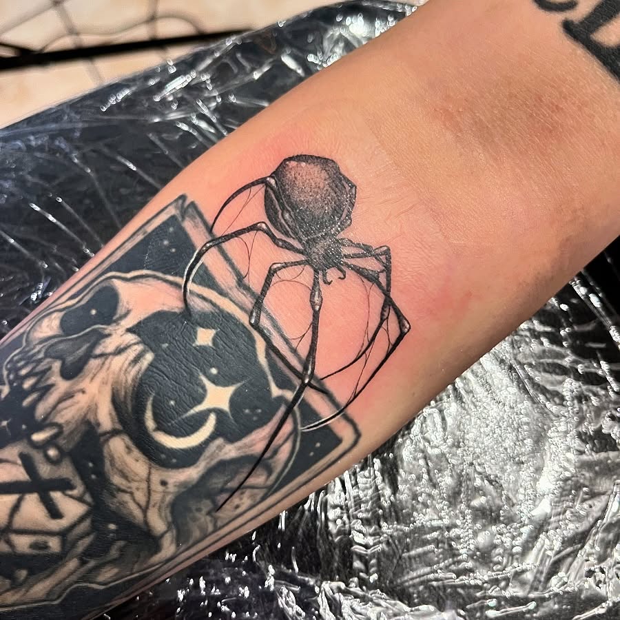 Spider black and grey tattoo on the forearm by Angie Morales, Laredo, Texas