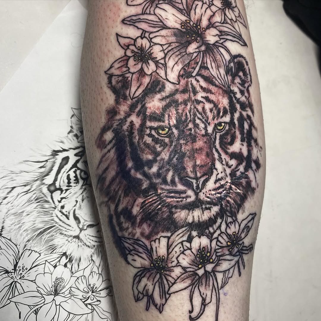 Tiger head with flowers realism tattoo on the forearm by MD Ariel🦷