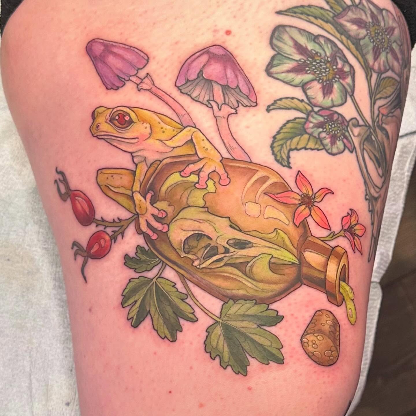 Frog and skull realism tattoo on the thigh by Cassidy Depew, Seattle, Washington