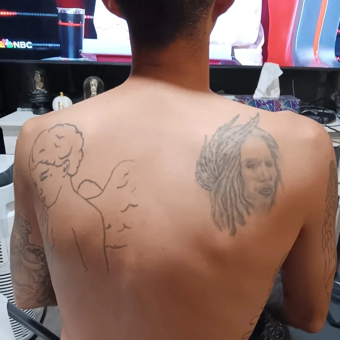 Portrait and angel black and grey tattoo on the back by Alfredo Sosa