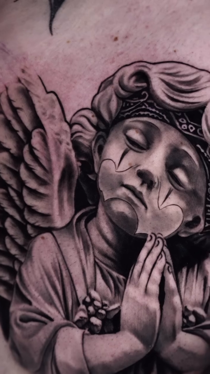 Cherub with praying hands realism tattoo by Armando Carpio, Miami, Florida