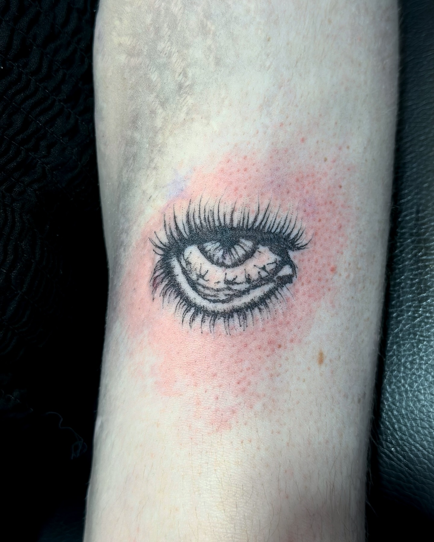 Eye realism tattoo on the forearm by cora cupid