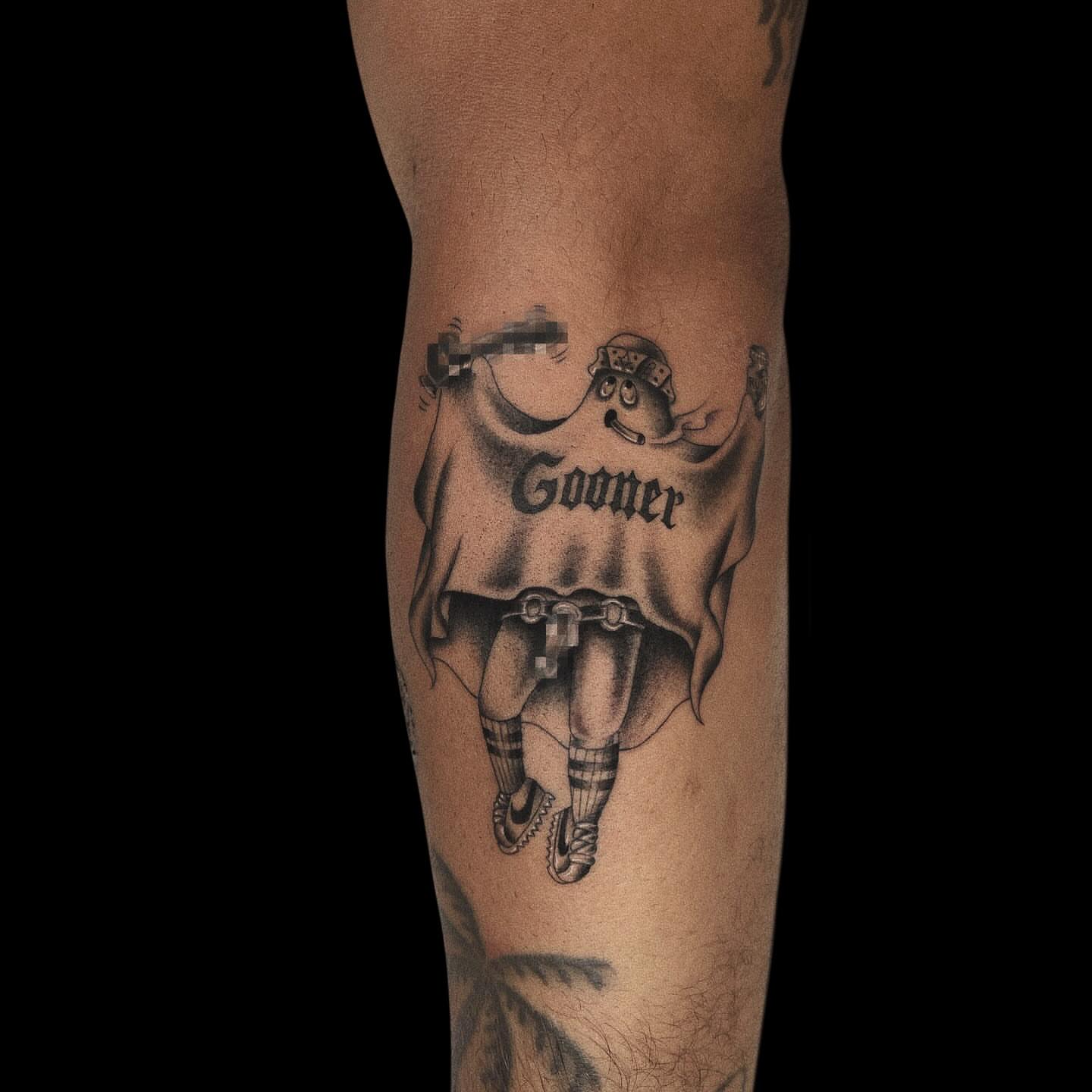 Football player black and grey tattoo on the forearm by Jason