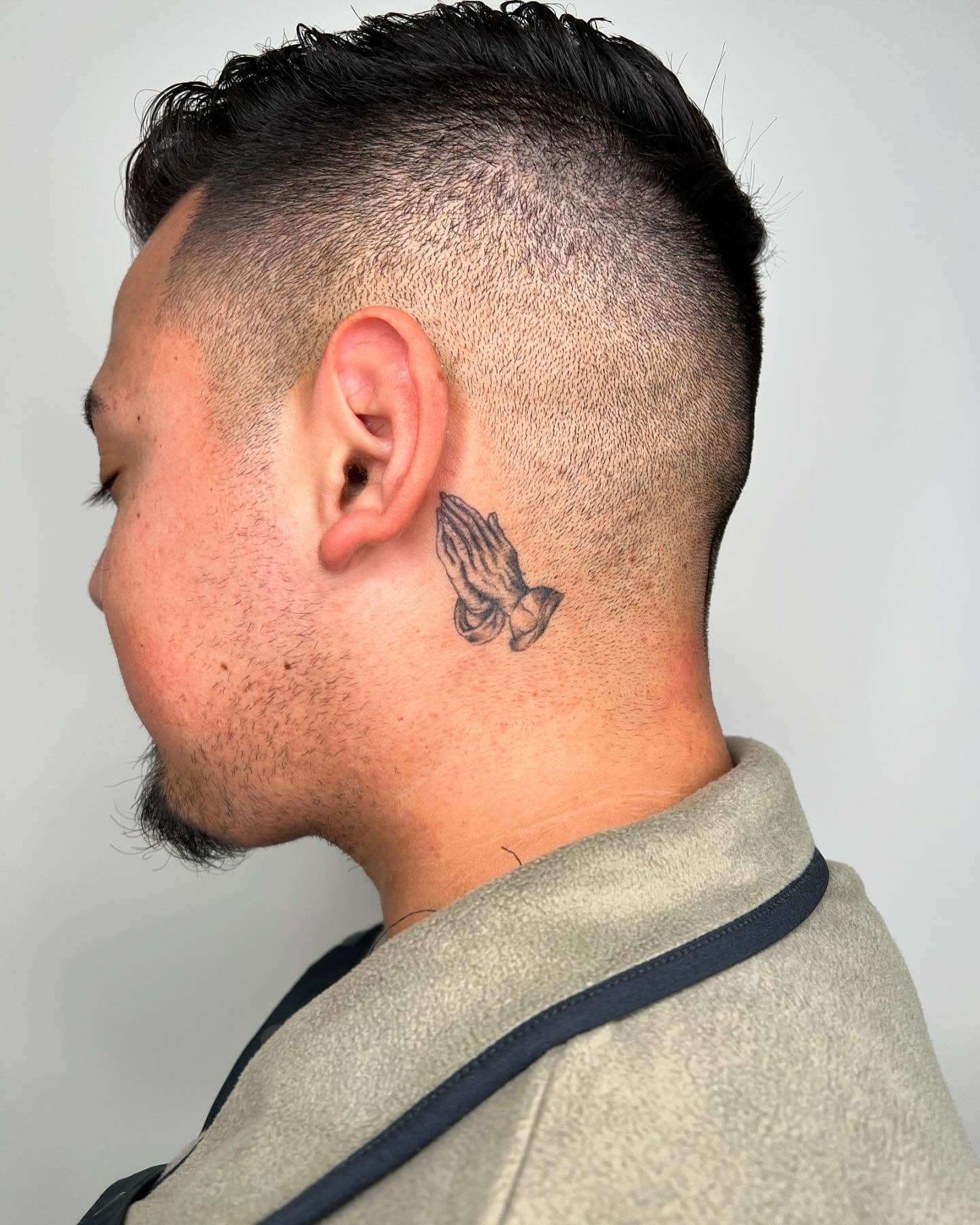 Praying hands black and grey tattoo on the neck by San Diego Fineline Black & Grey Tattoo Artist