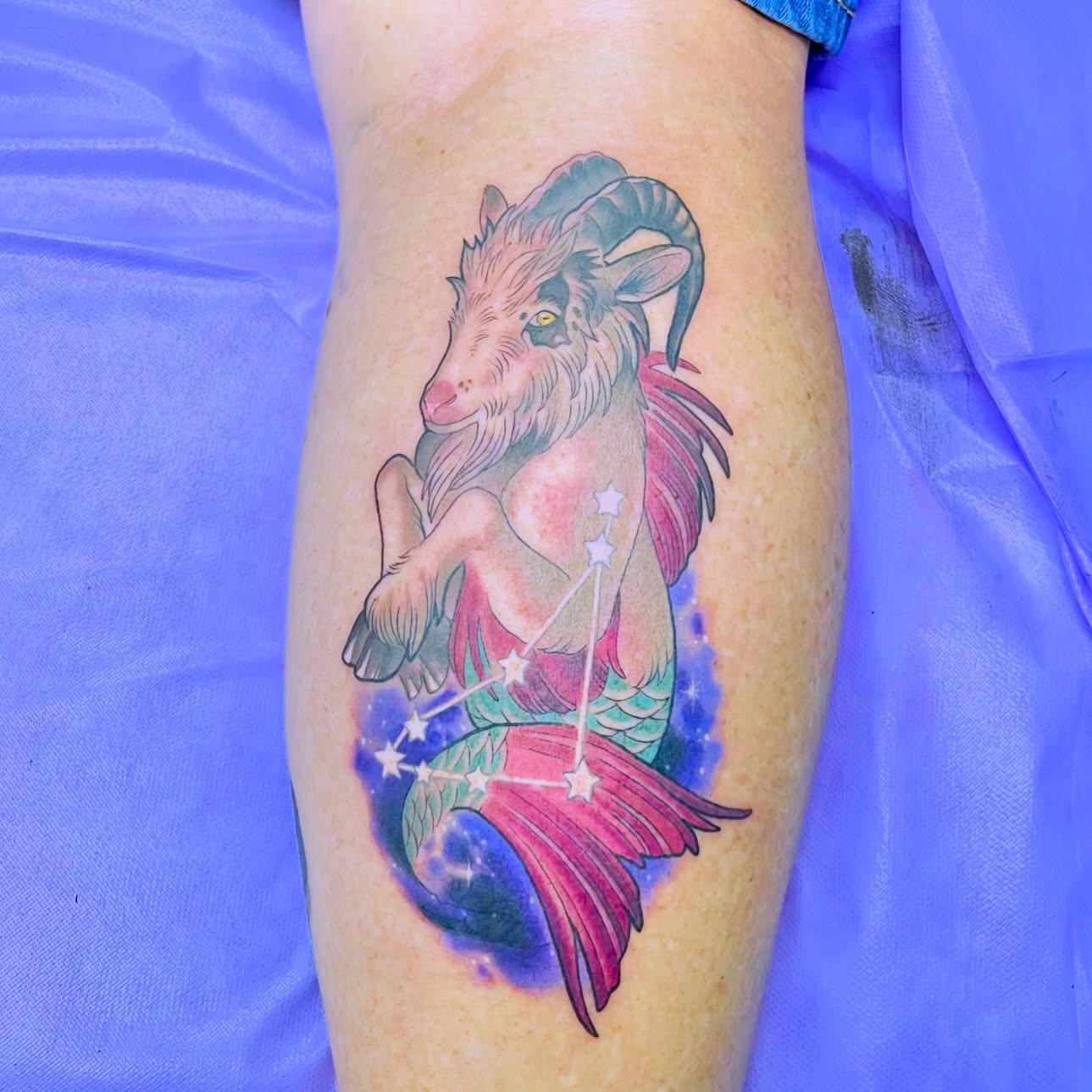 Goat mermaid constellation new school tattoo on the thigh by Angelique Sanders, Tellico Plains, Tennessee