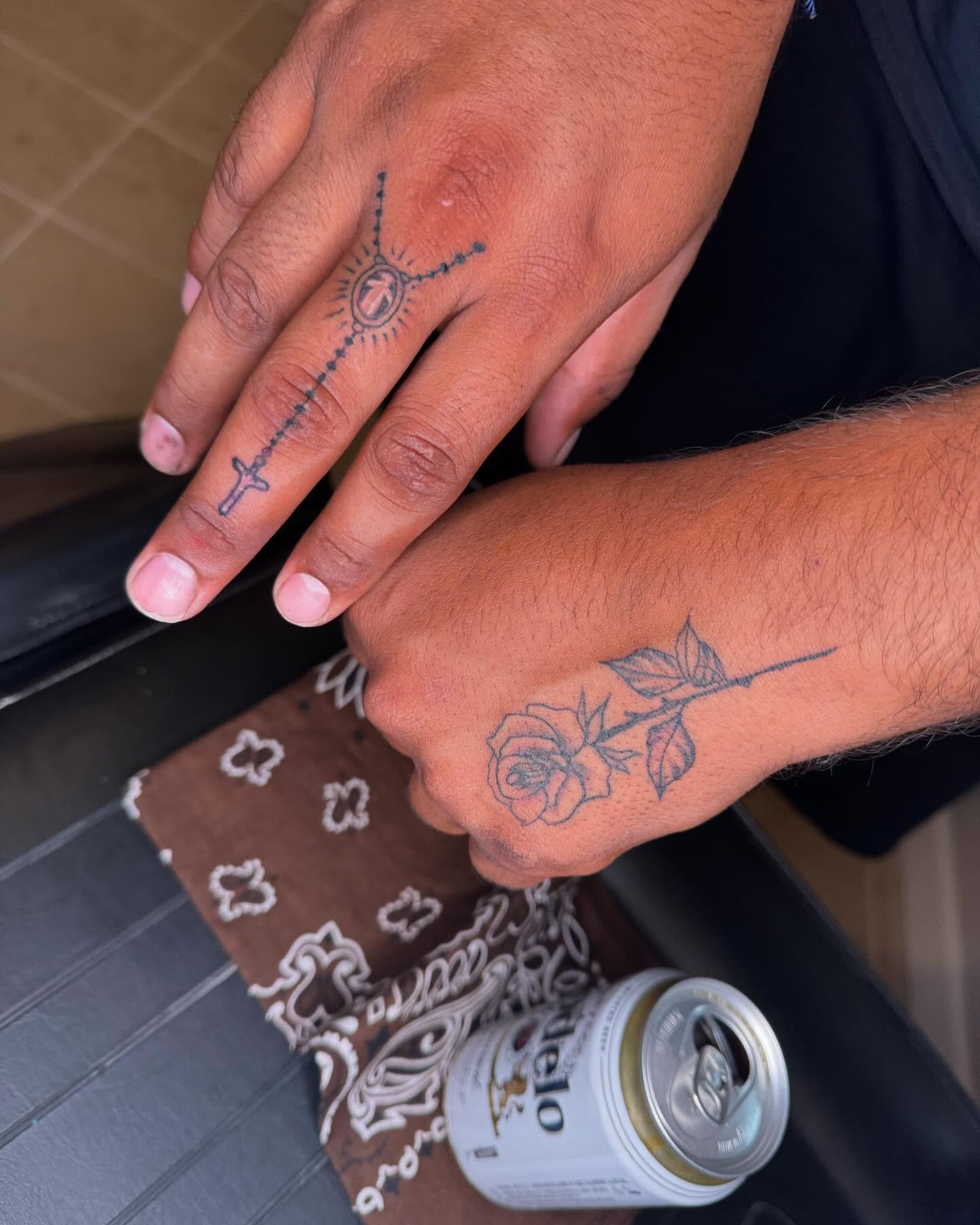 Cross and rose black and grey tattoo on the hand by Sonia vidal