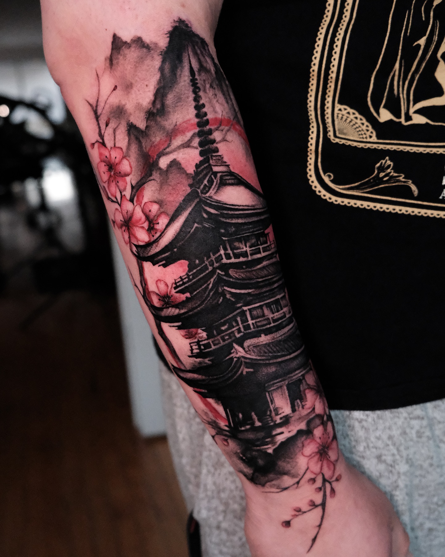 Cherry blossoms and pagoda japanese irezumi tattoo on the forearm by Ohio Tattoo Artist - Tehya Maxwell, Springfield, Ohio