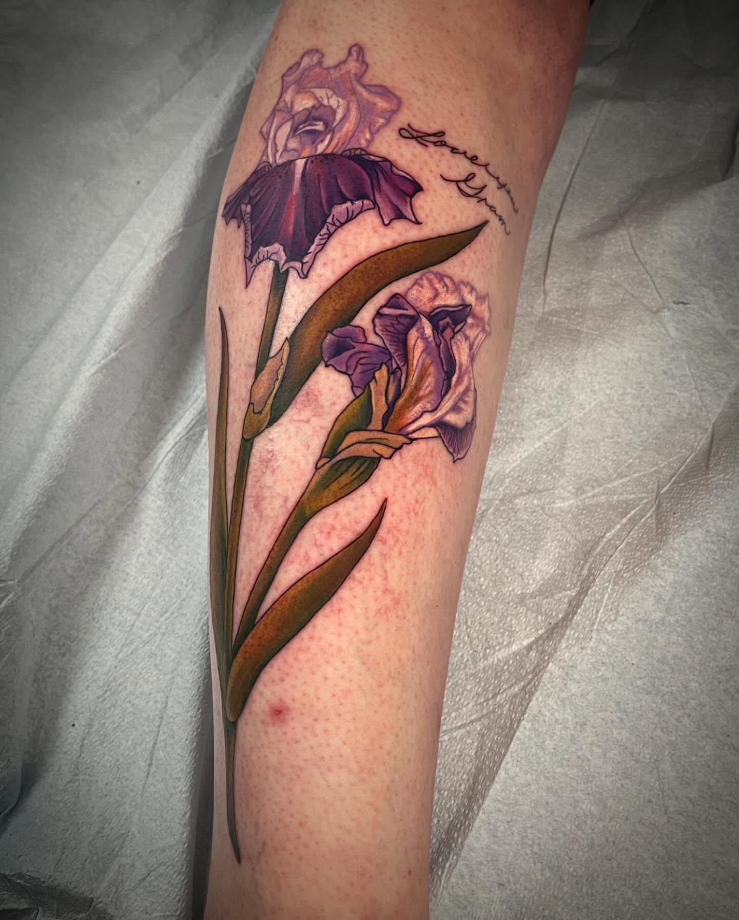 Iris flowers realism tattoo on the forearm by 𝓚𝓪𝓼𝓼𝓪𝓷𝓭𝓻𝓪 𝓜𝓬𝓒𝓪𝓵𝓵, Eugene, Oregon