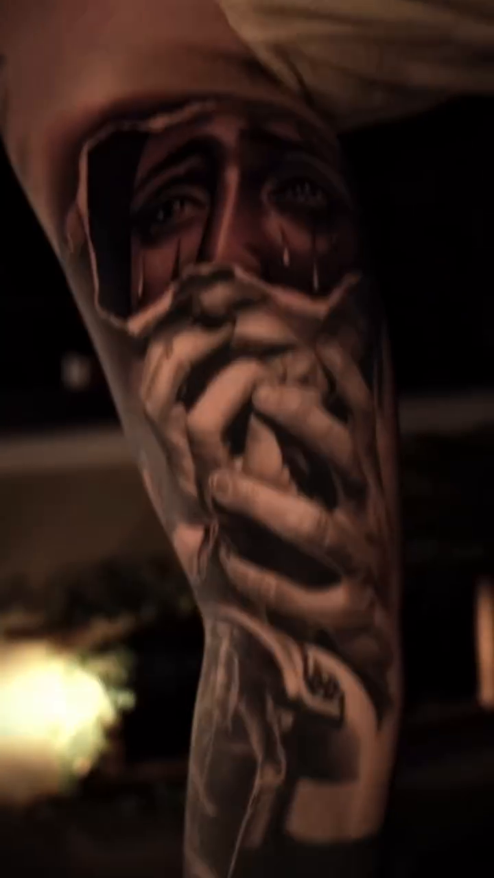 Crying face with hands realism tattoo by @kotytattoos