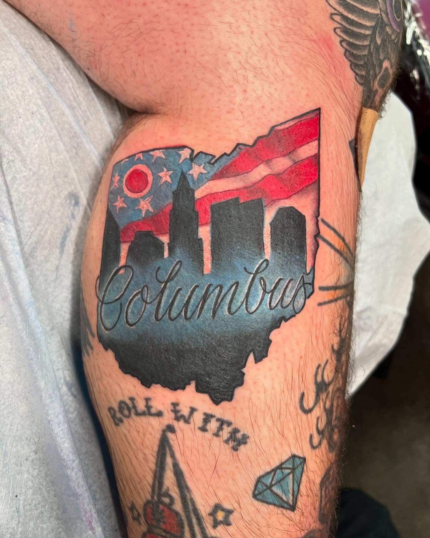 Columbus skyline American traditional tattoo on the thigh by Dustin Hysell