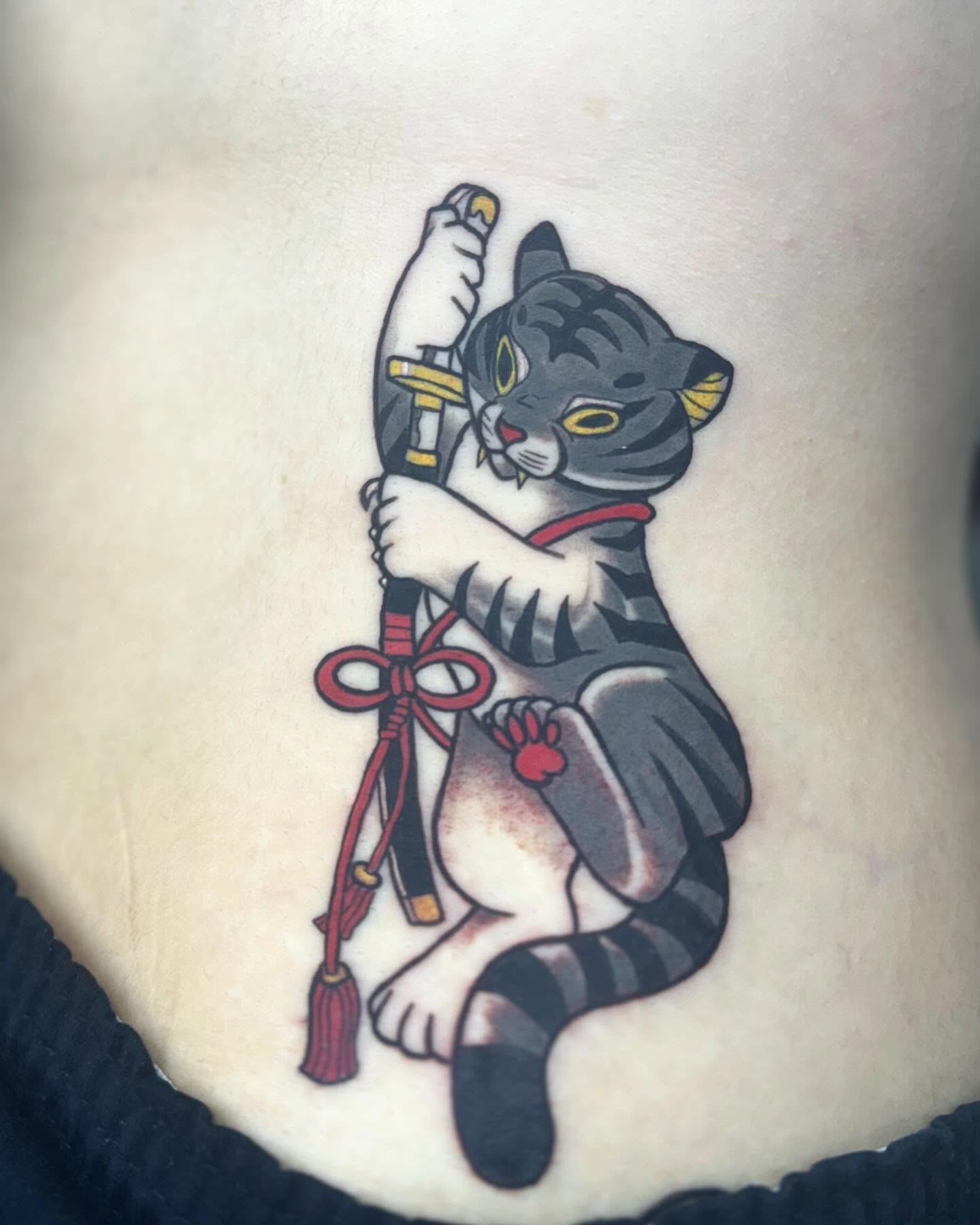 Cat with sword American traditional tattoo on the torso by Kevin A. Salinas ๐จ๐ด, Houston, Texas