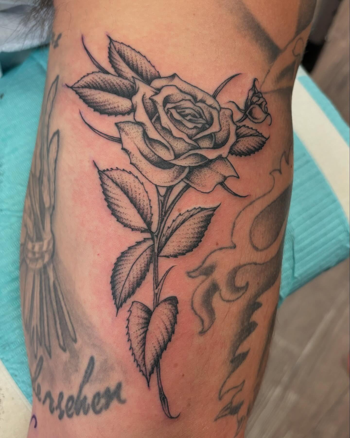 Rose black and grey tattoo on the forearm by Brayden P Tattoo