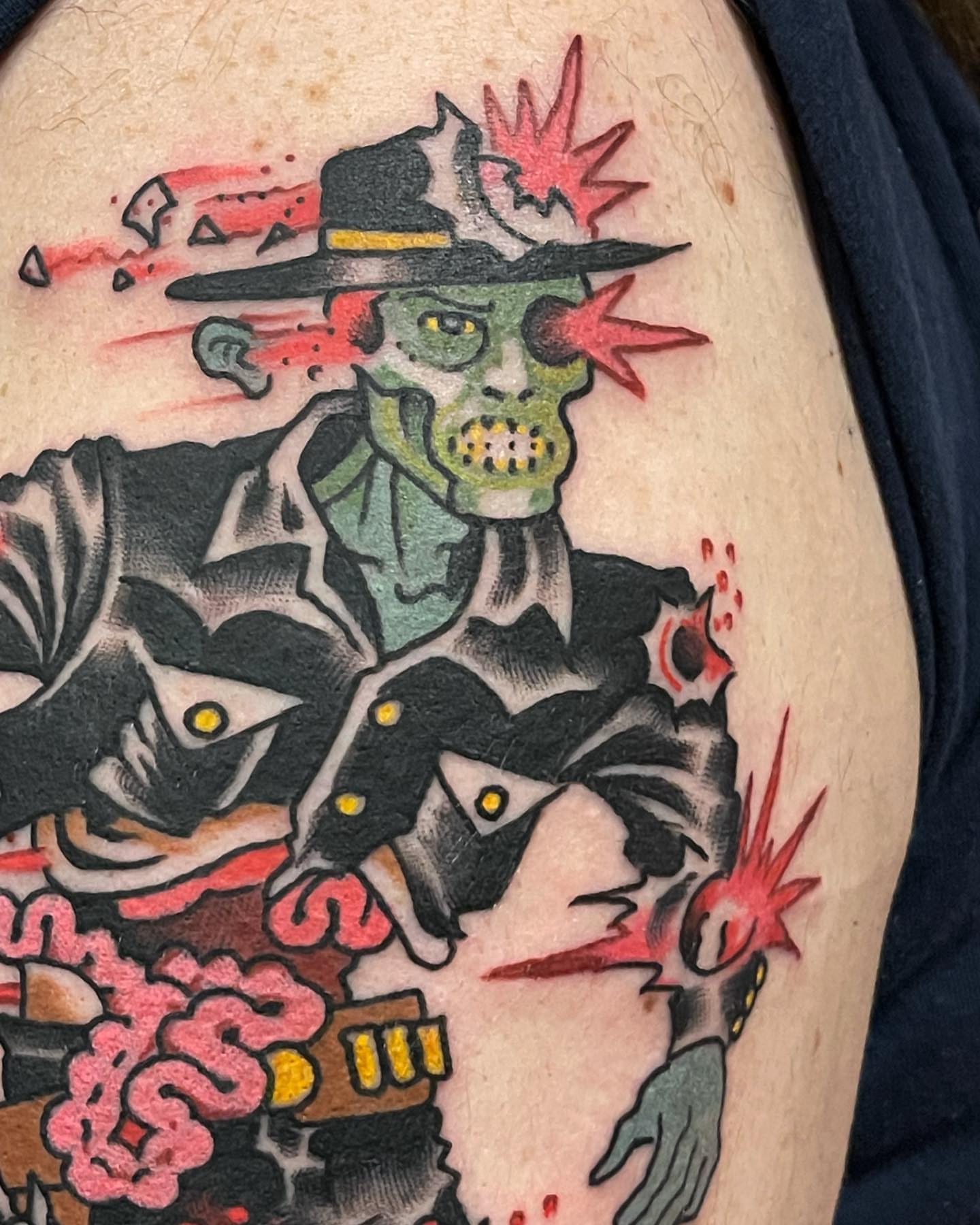 Zombie in hat American traditional tattoo on the upper arm by Ian Bederman, Austin, Texas