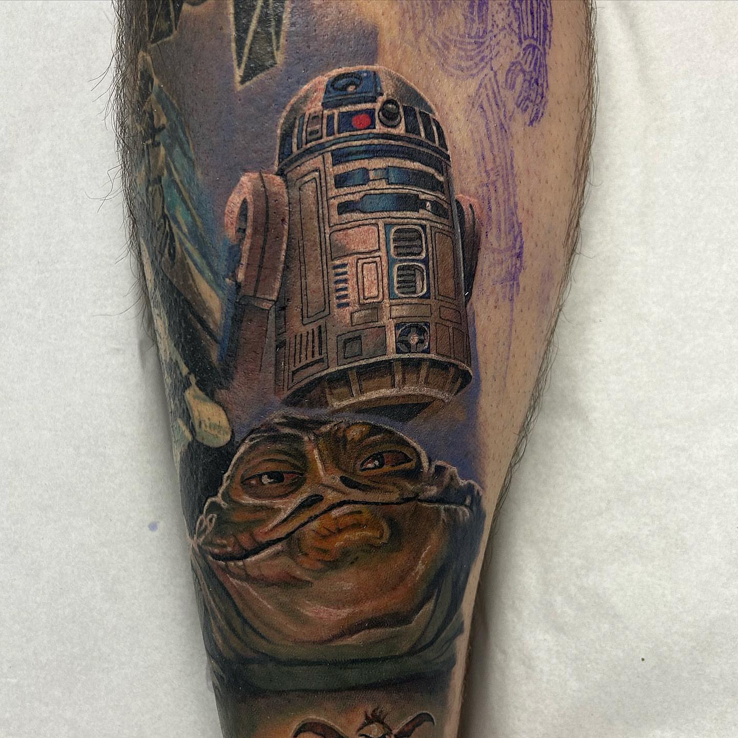 Jabba the hutt and r2d2 realism tattoo on the forearm by Adam Zgorliski_STStattoo