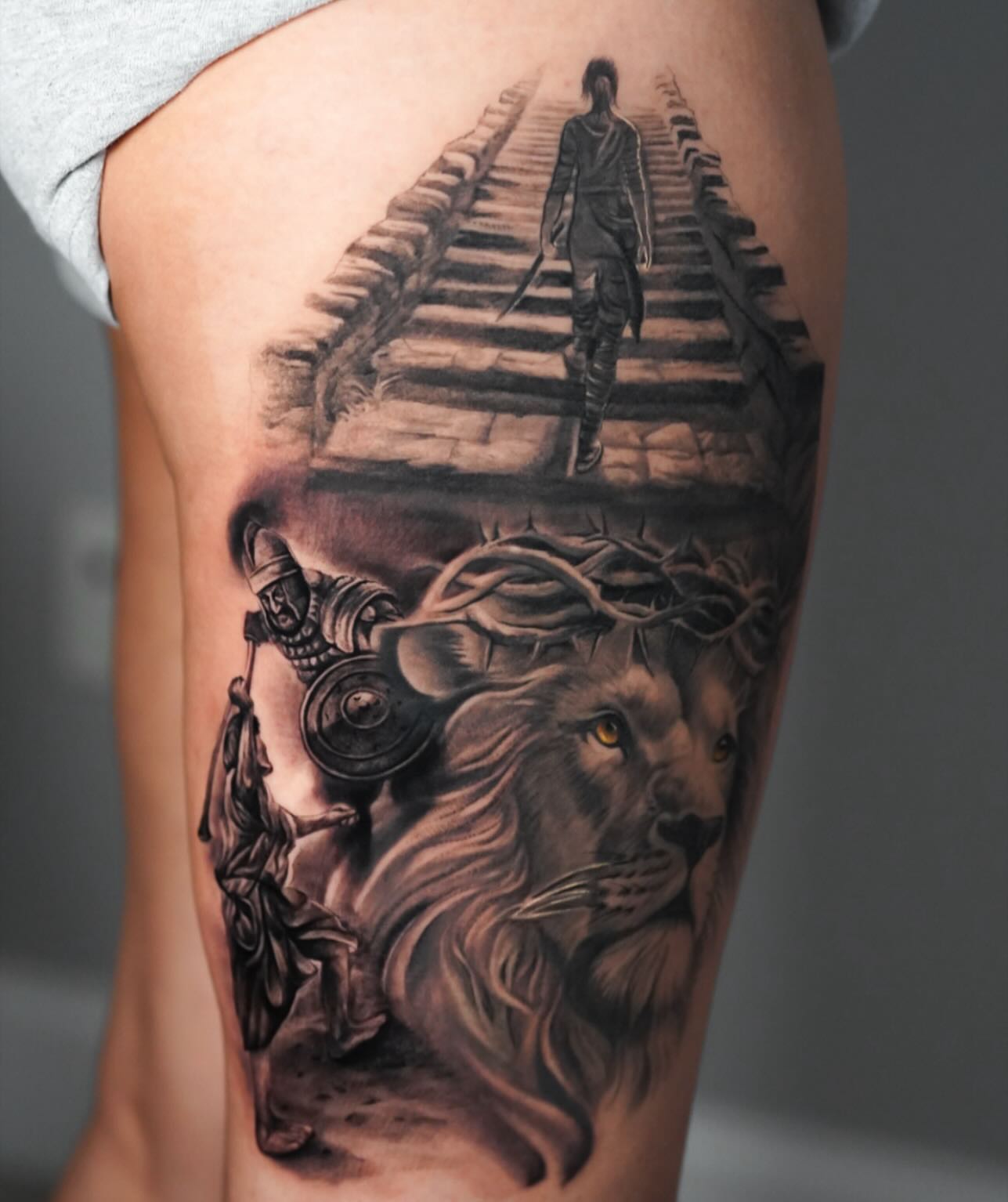 Lion and warrior realism tattoo on the thigh by David Gordon