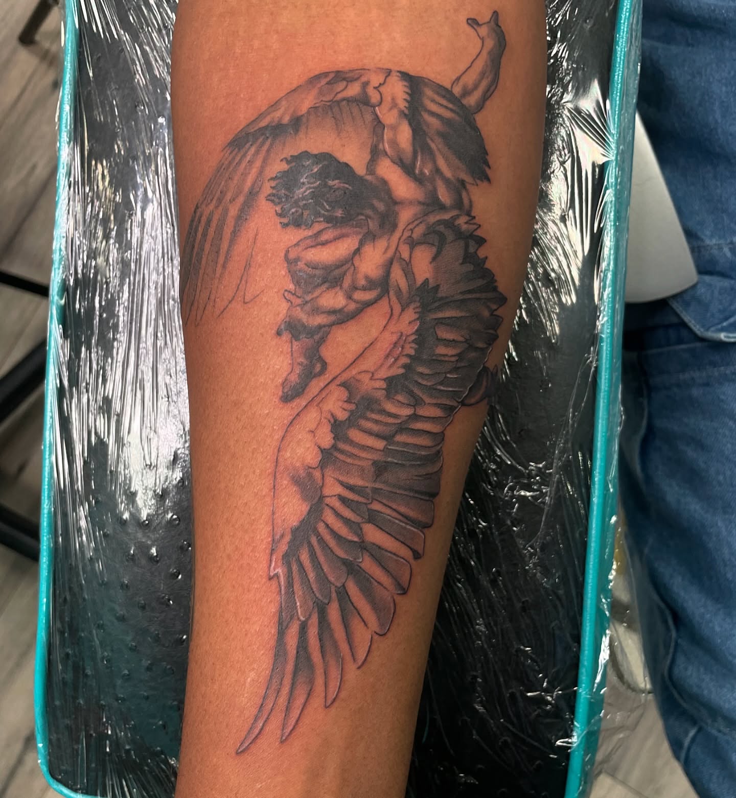 Angel black and grey tattoo on the forearm by Visionary🌌