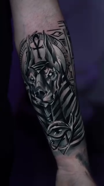 Anubis head with Egyptian motifs realism tattoo by Andres García Baeza