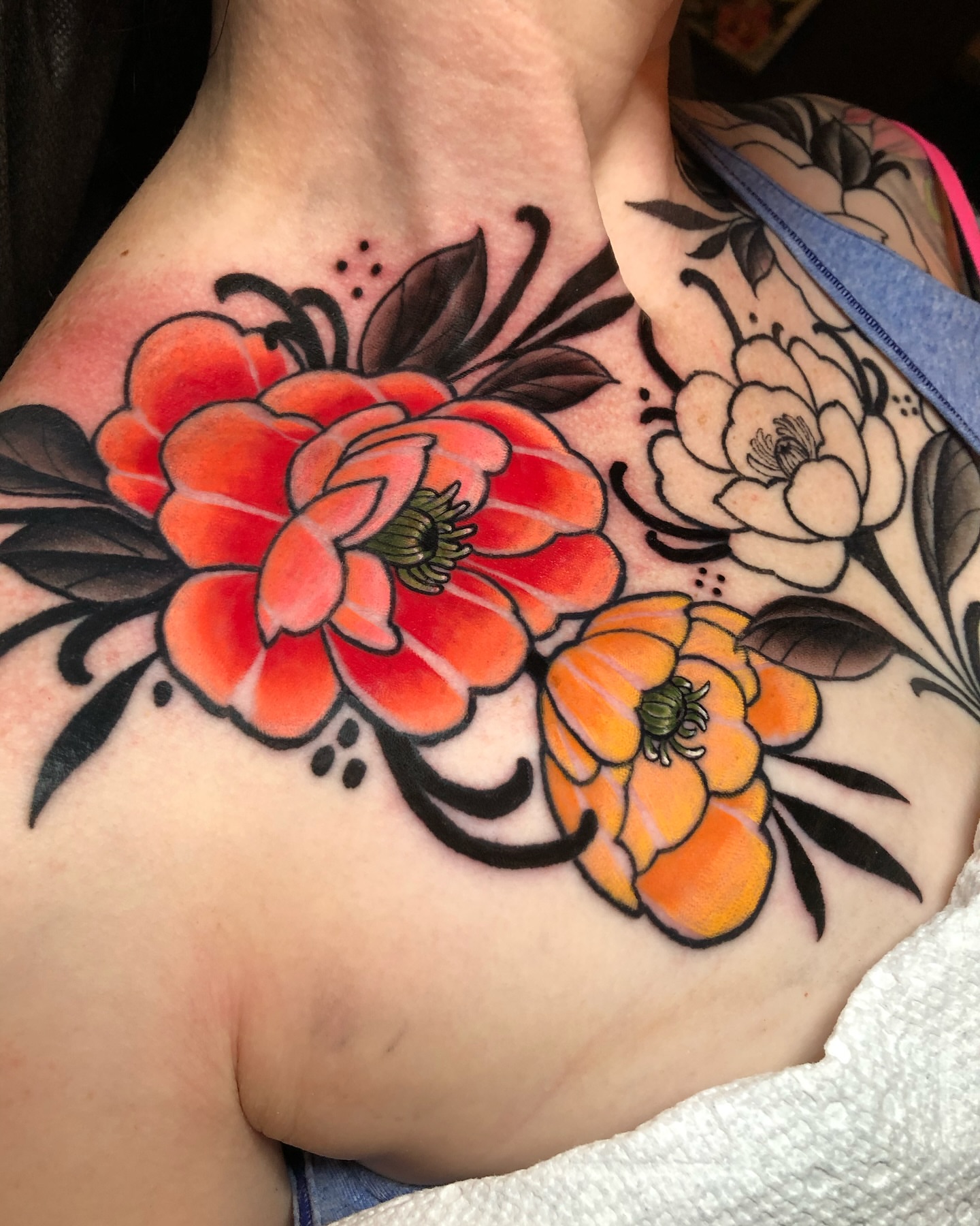 Floral bouquet American traditional tattoo on the shoulder by Melissa Brown