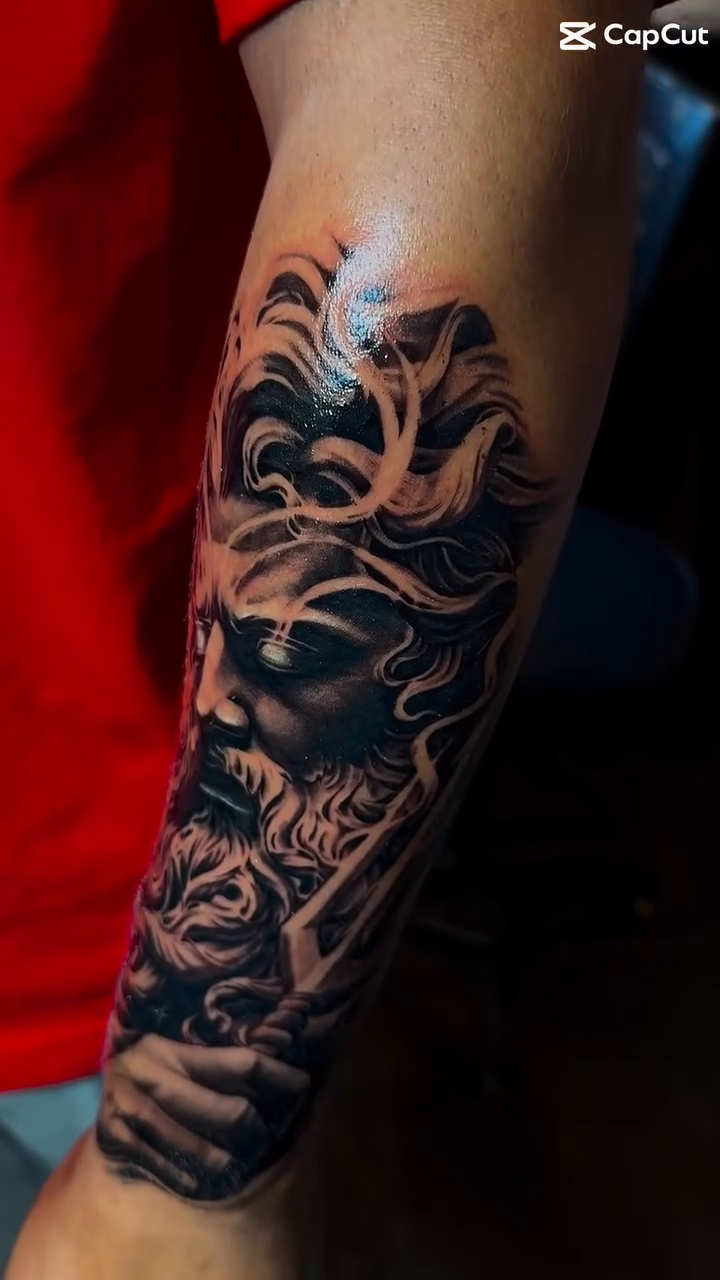 Man's face with flowing hair realism tattoo by Bernie calderon, Fresno, California