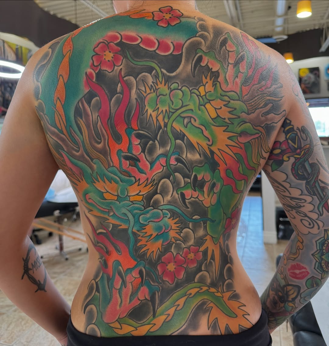 Dragon and flowers Japanese tattoo on the back by Cary Aldridge
