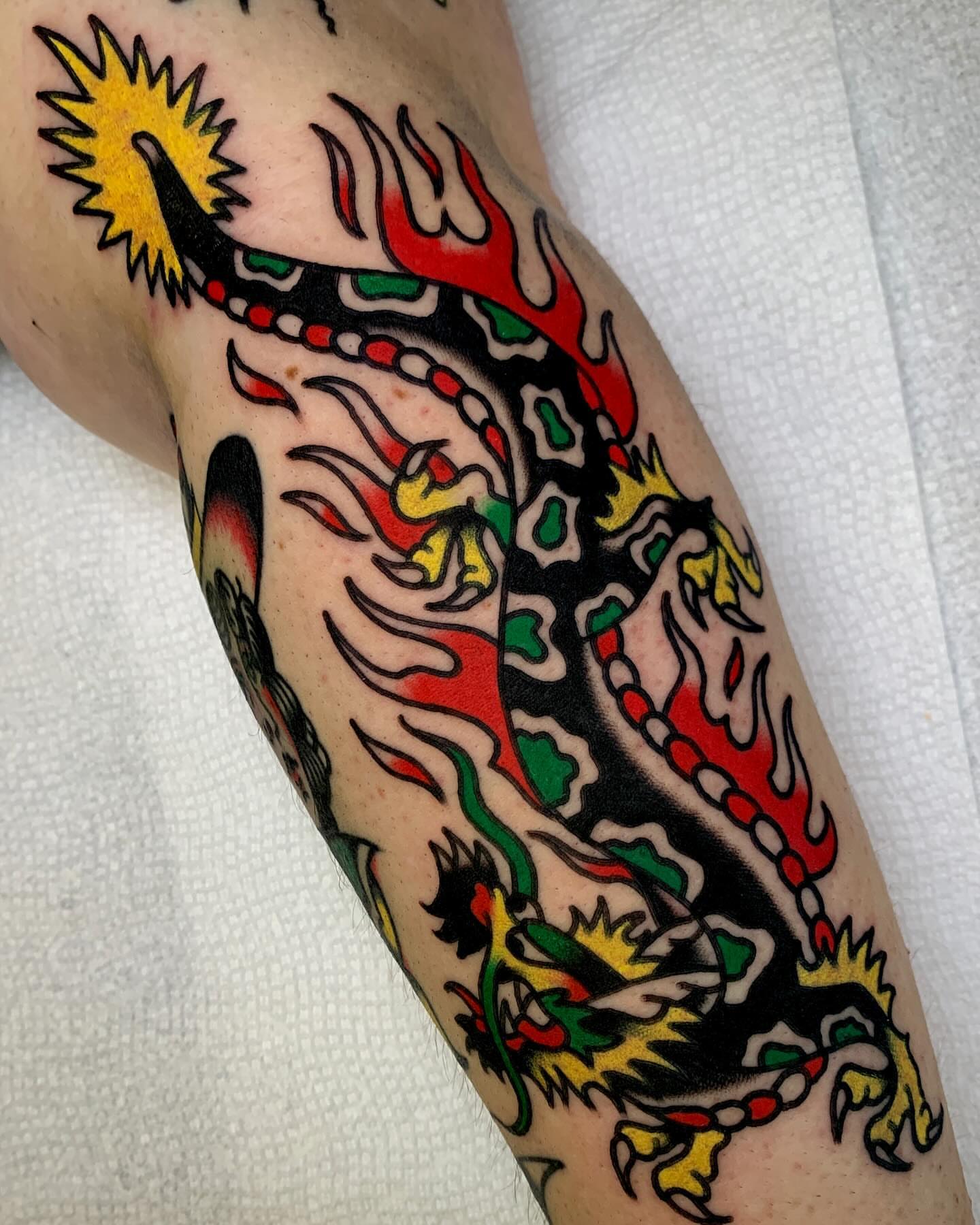 Dragon American traditional tattoo on the forearm by Zachary - Traditional Tattoo Artist