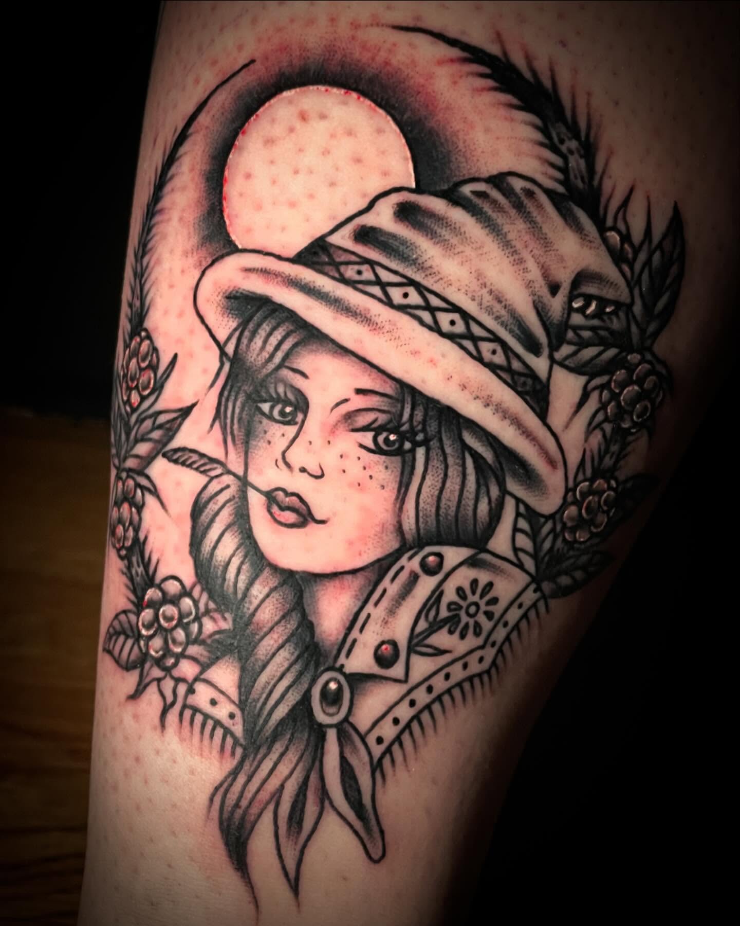 Woman wearing hat American traditional tattoo on the forearm by Madison ‘Maddog’ Stewart