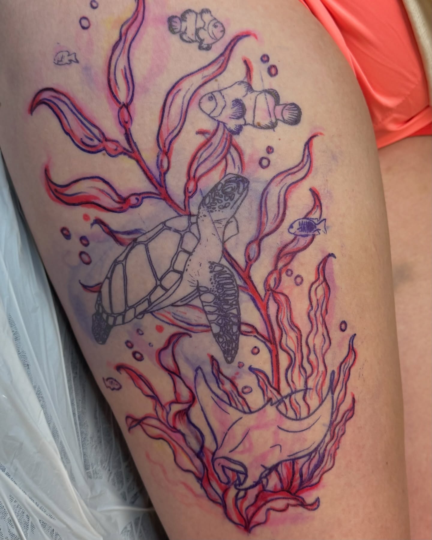 Sea turtle and coral watercolor tattoo on the thigh by Kathryn Semus