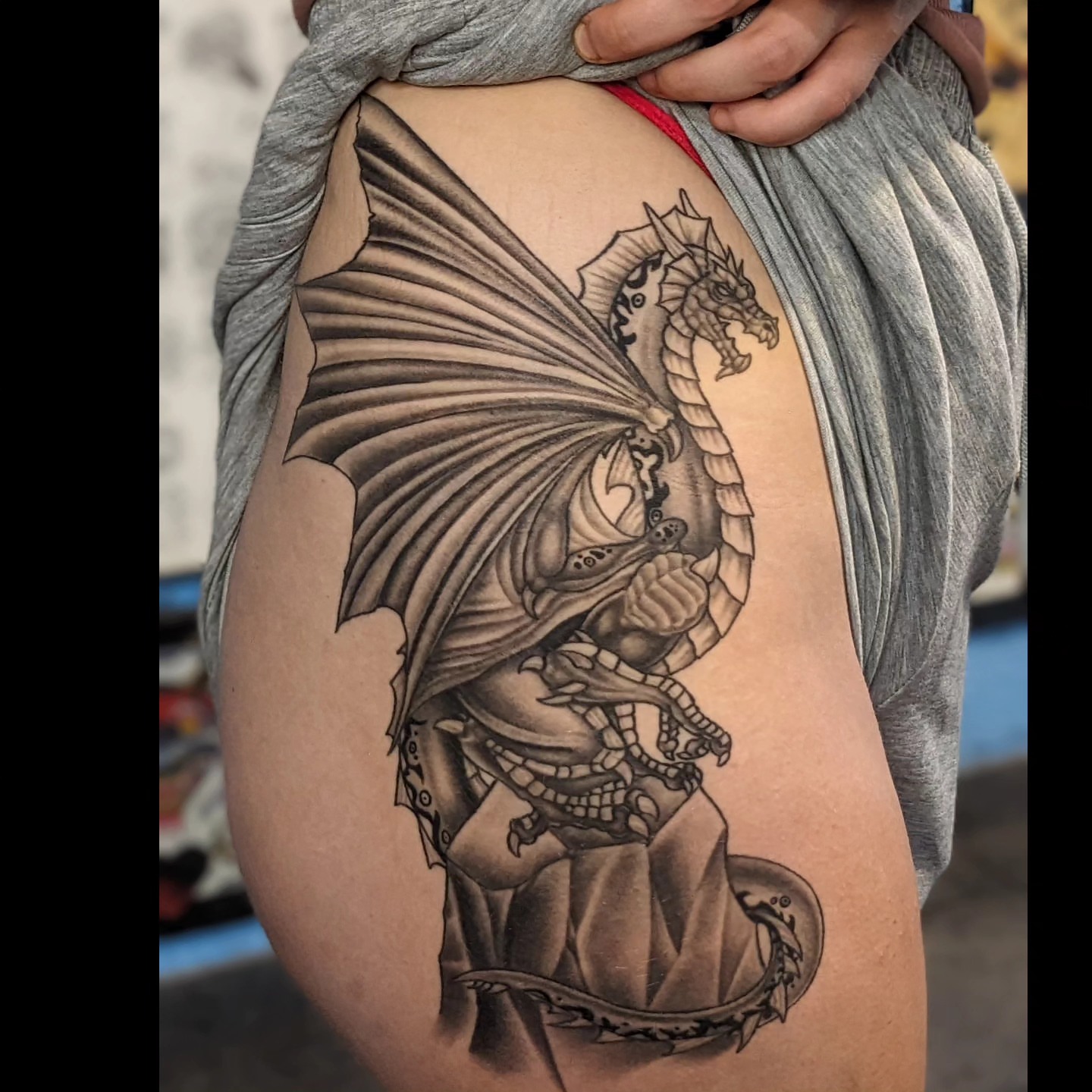 Dragon realism tattoo on the thigh by Matt Simmonds