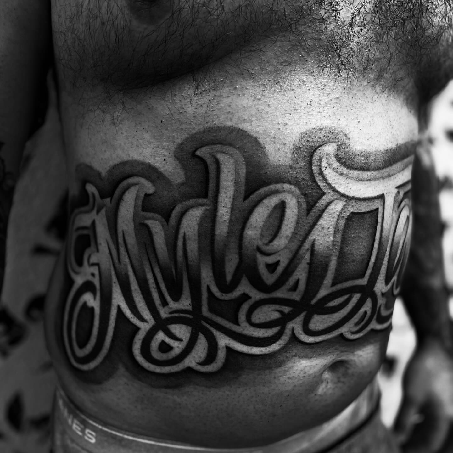 Tattoo by @inkplug__higherlevel — lettering_script